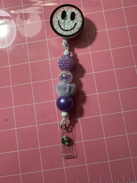 WHITE SMILEY BADGE REEL